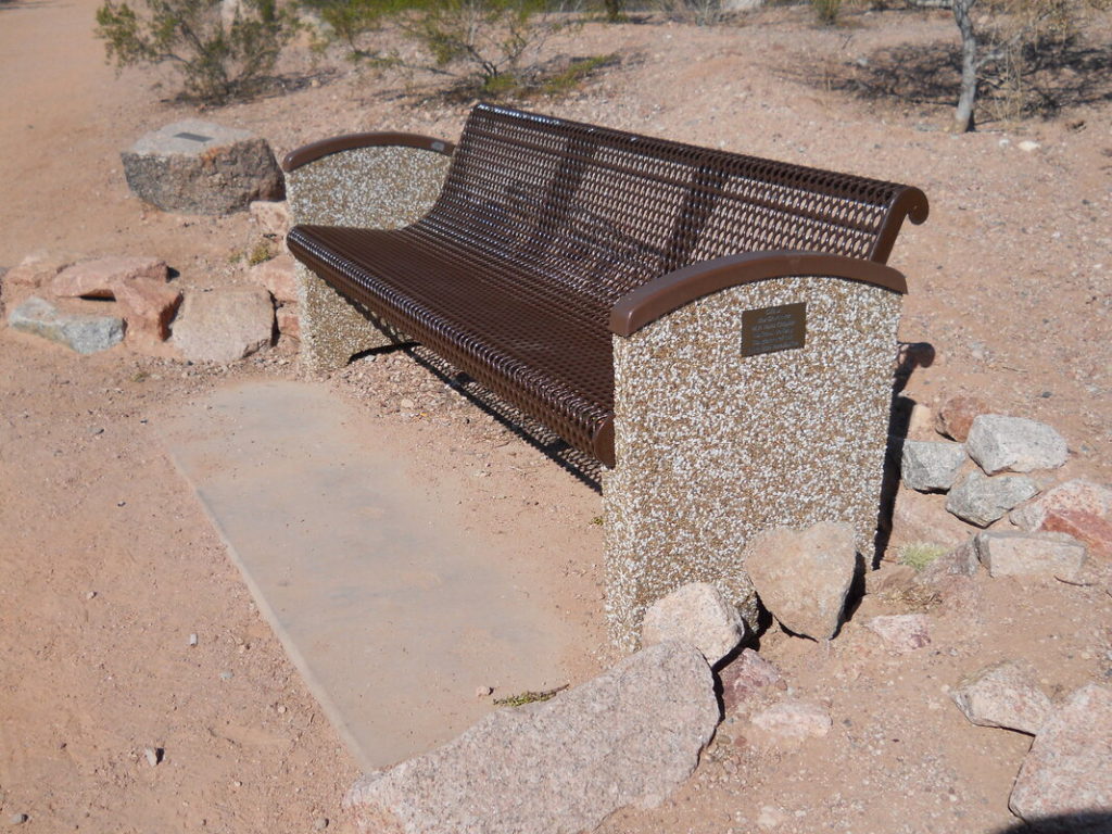 This photo shows a metal bench near the Tomb donated by the Governor George W.P. Hunt Chapter.