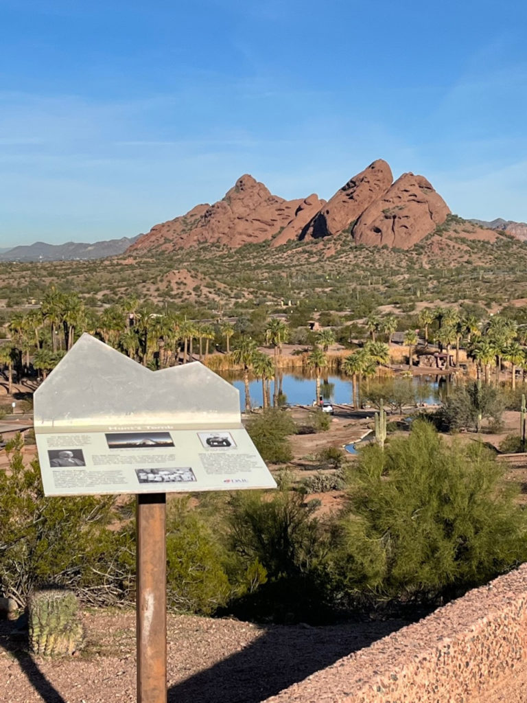 This photo shows an educational sign about Hunt's Tomb overlooking Papago Park.